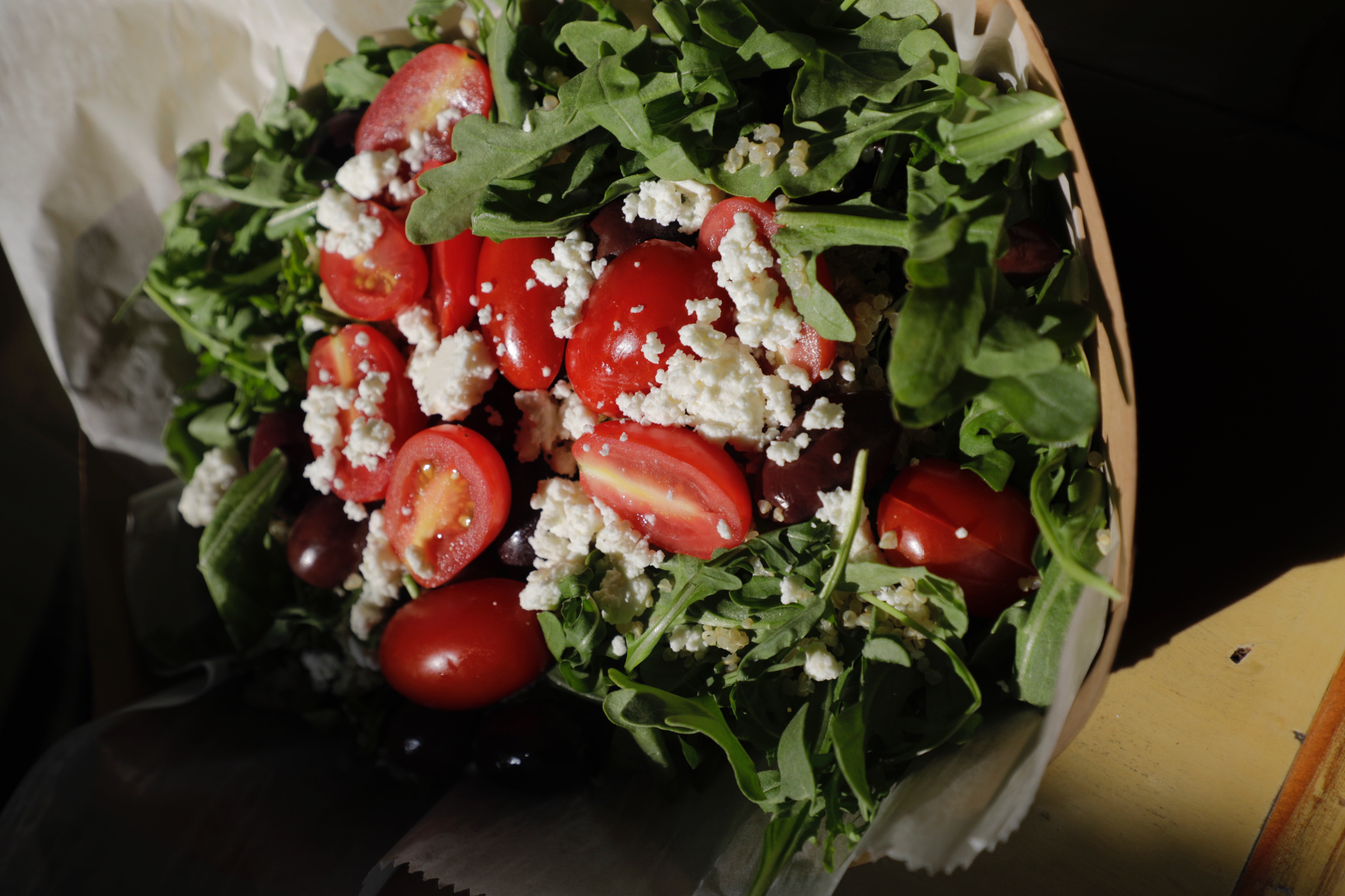 Arugula salad with cherry tomatoes and crumbled feta