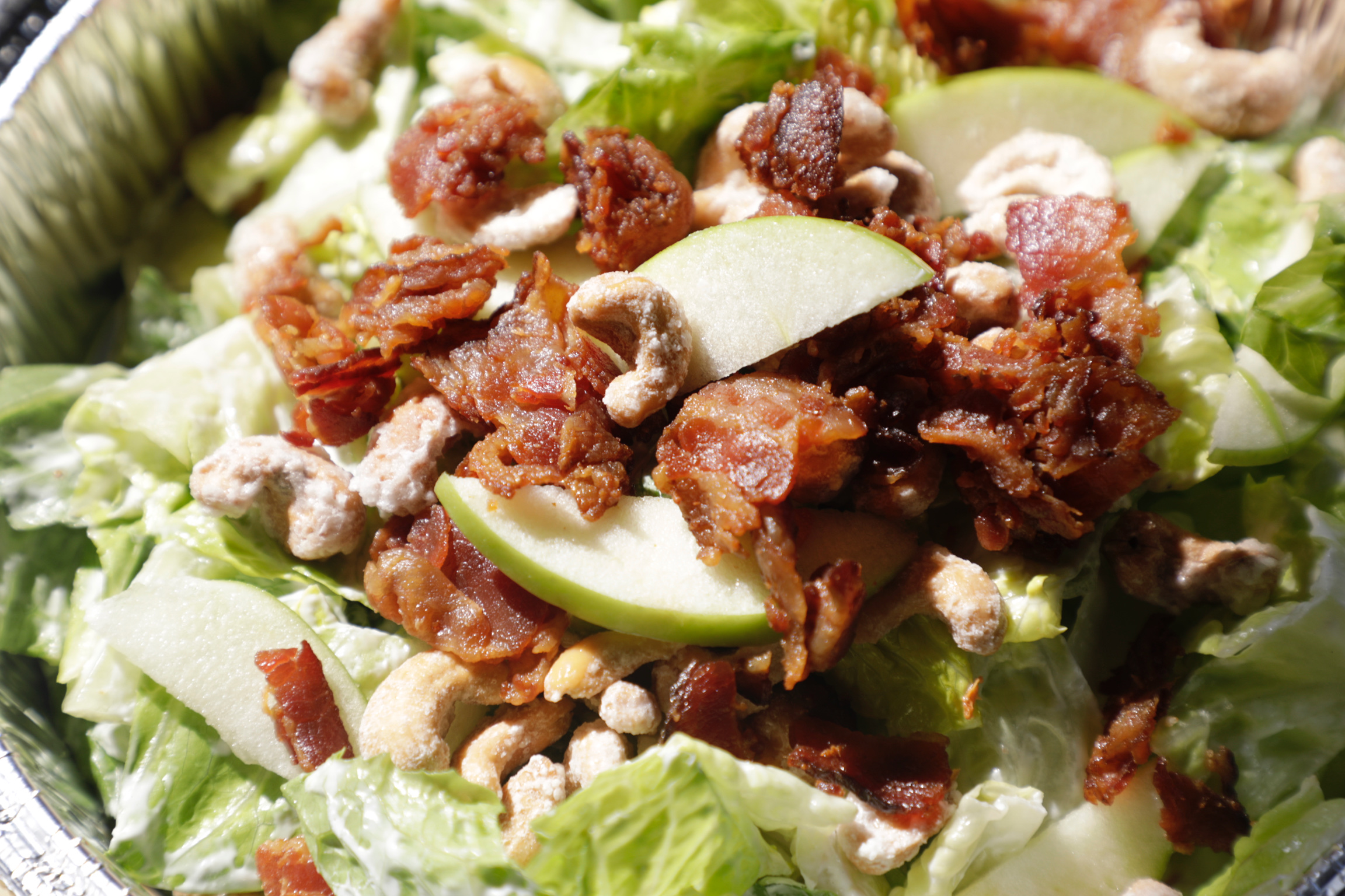 Chopped salad with bacon, shaved apple and candied cashews